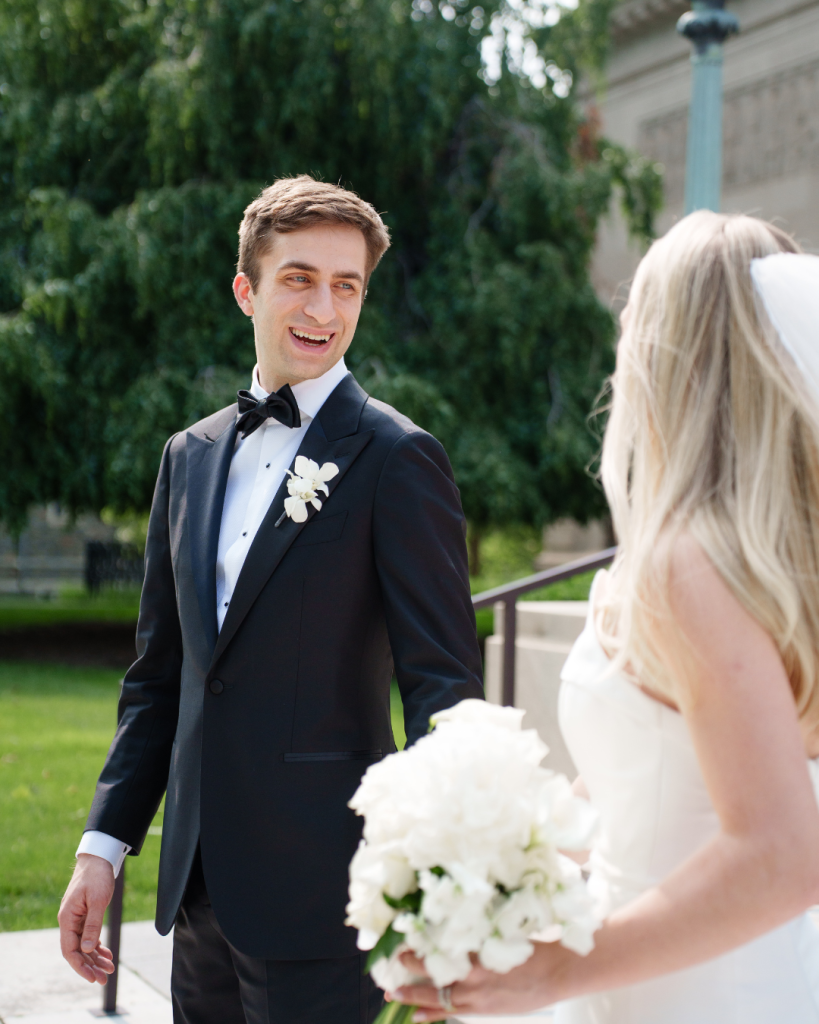 Kyle smiles at Marielle during their first look moment outdoors