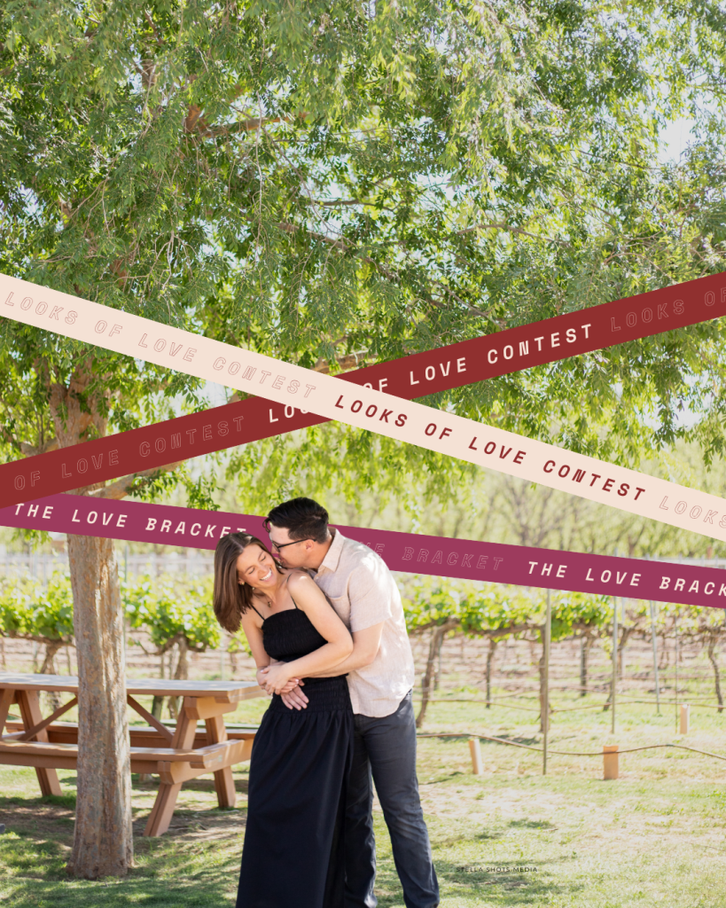 Engaged couple kissing under decorative ribbons at outdoor vineyard