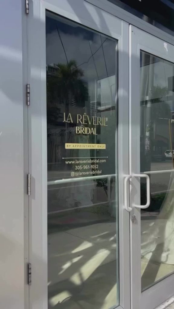 La Reverie Bridal storefront entrance with glass doors in Miami