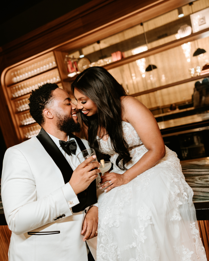 Romantic bride and groom portrait at the bar during Ana and Devante’s classic spring wedding at The Casey in Charlotte