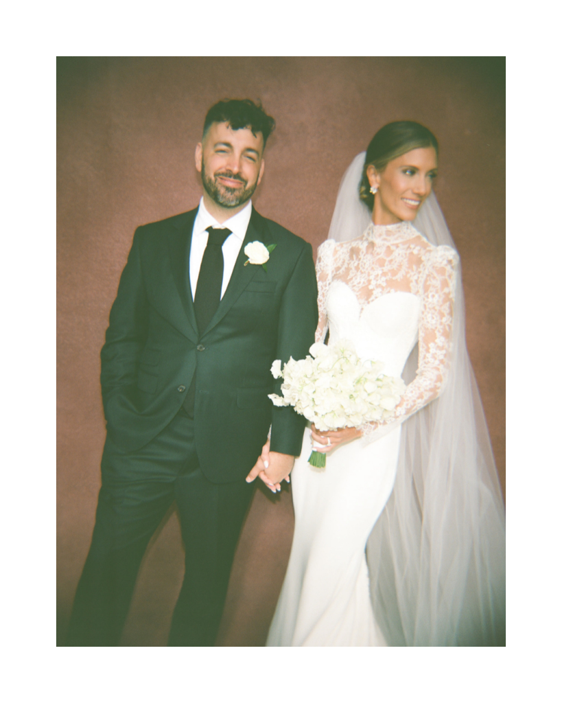 Portrait of Cathy and Charlie with a vintage inspired aesthetic, bride in lace sleeve gown and groom in black suit