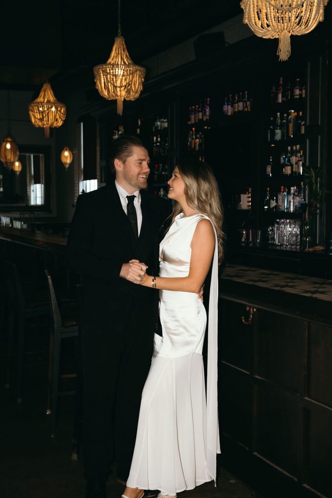 Couple holding hands in the Bellwether Downtown captured by Mad Land Photography