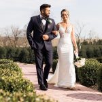 husband and wife walking outside after outdoor wedding ceremony