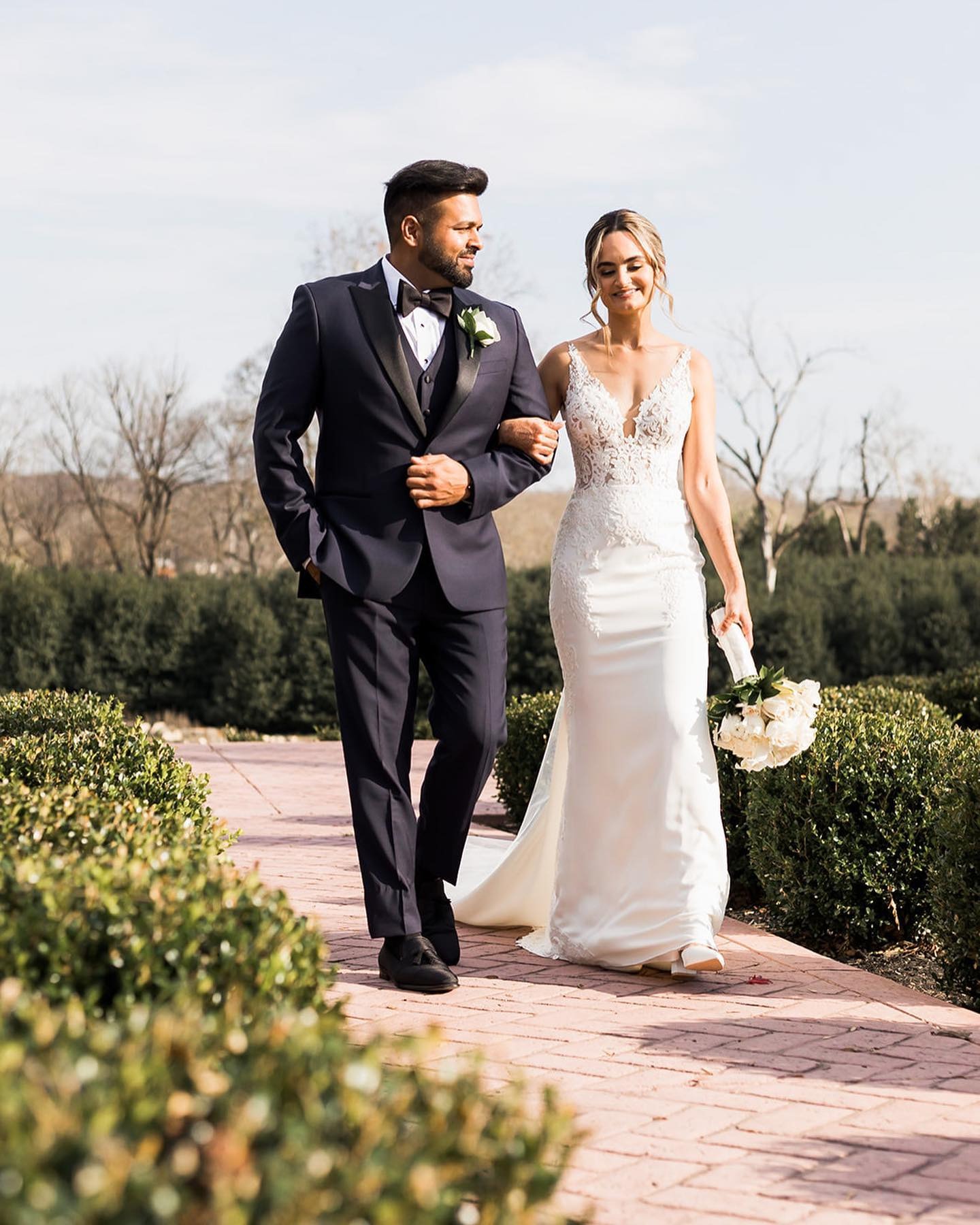 husband and wife walking outside after outdoor wedding ceremony