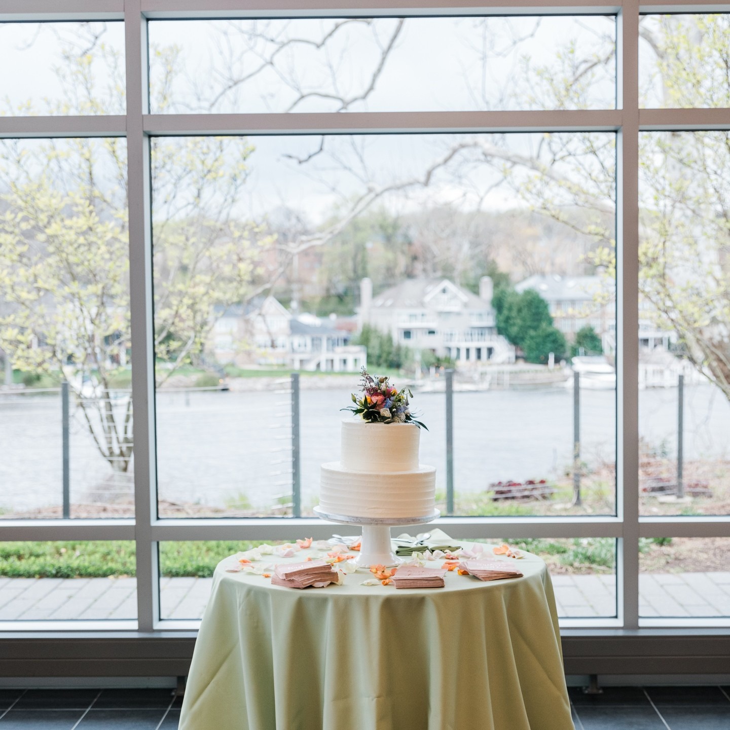 Wedding Cake at indoor wedding reception looking out over waterfront