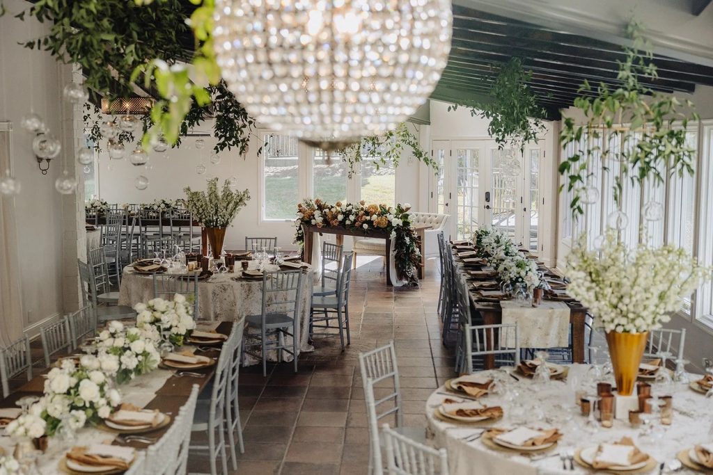 Indoor wedding reception space with large chandelier