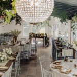 Indoor wedding reception space with large chandelier