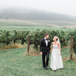 Bride and Groom taking pictures outside at vineyard in loudoun county
