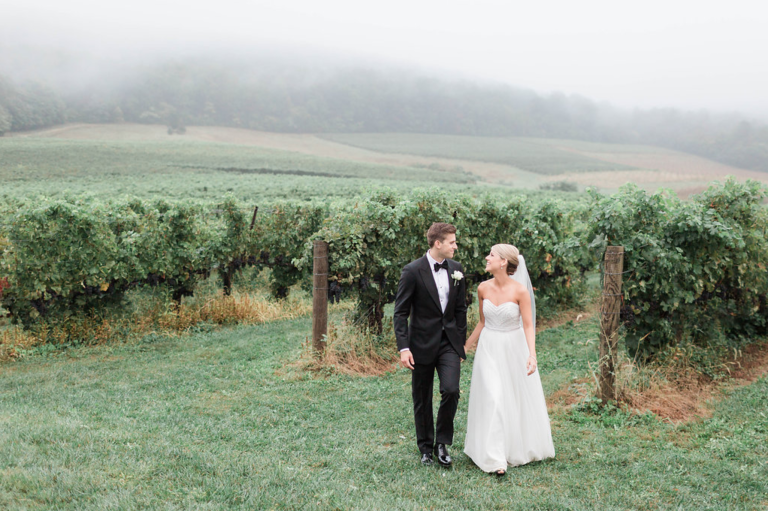 Bride and Groom taking pictures outside at vineyard in loudoun county