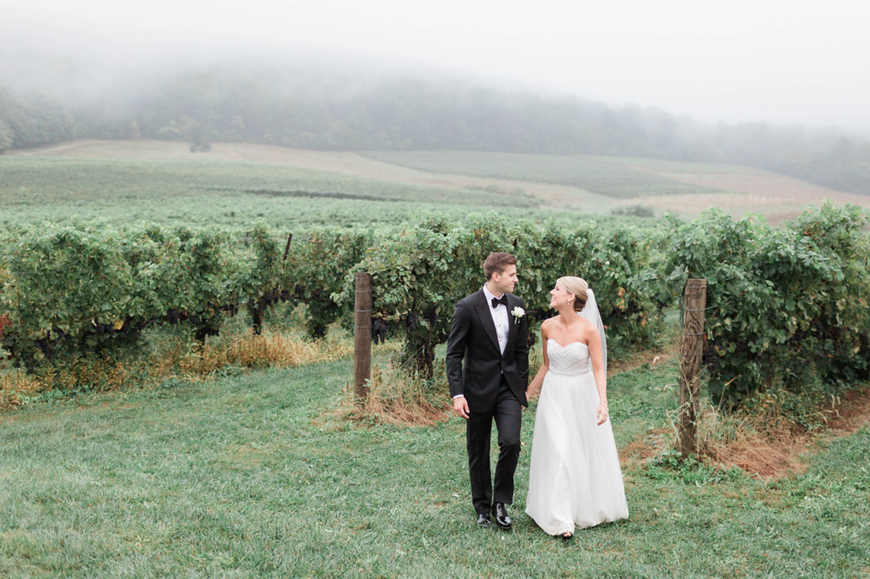 Bride and Groom taking pictures outside at vineyard in loudoun county