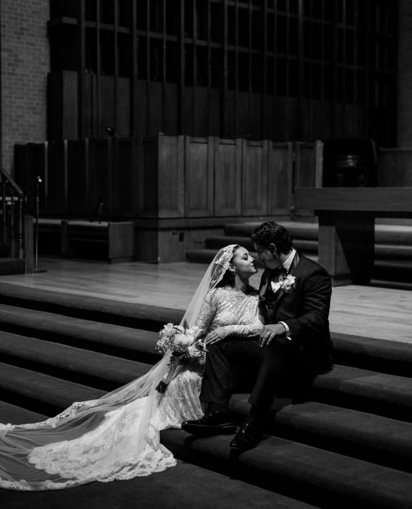 Bride and groom portrait on church staircase