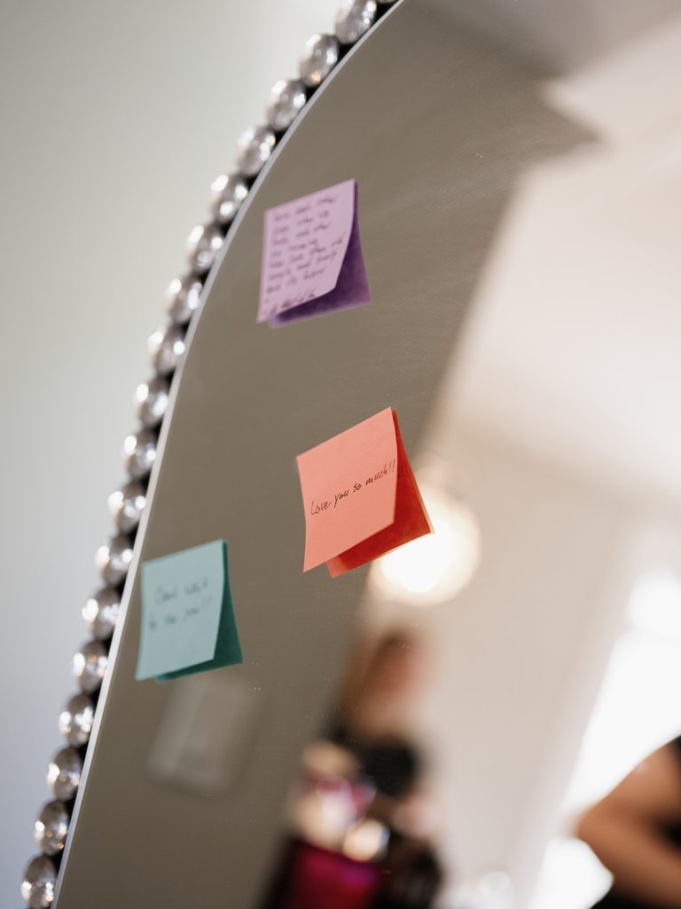 love notes on sticky notes on getting ready mirror