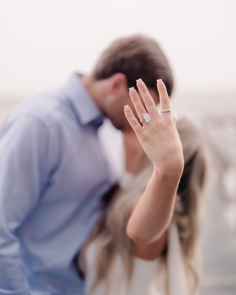 Close-up of engagement ring during a marshside proposal in Savannah, Georgia, photographed by Esther Griffin Photography.