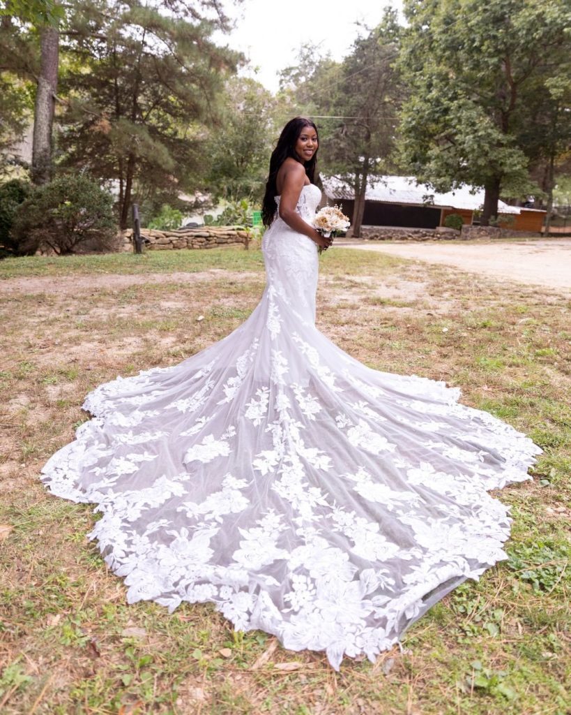 bride with lace train fluffed out