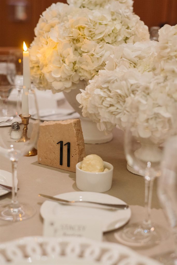 White hydrangea center pieces by Roses + Mint.
