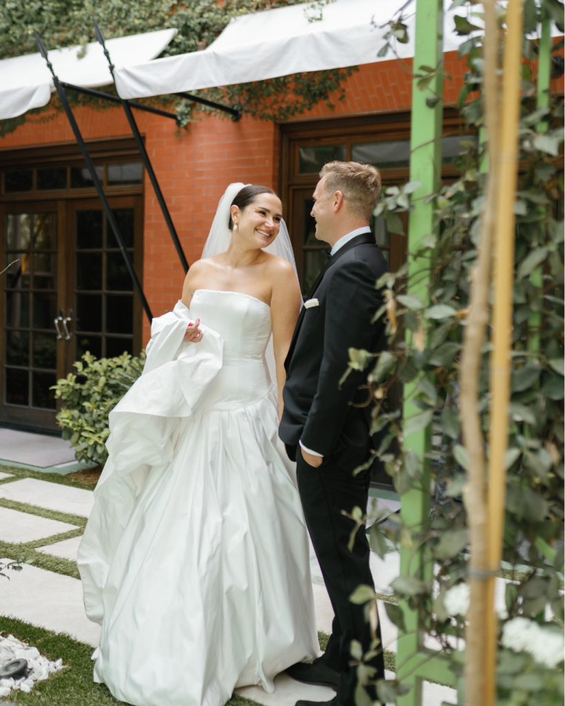Bride and groom walking outside venue, bride smiling in full gown, September 2025 wedding planned by Lea from LM Events