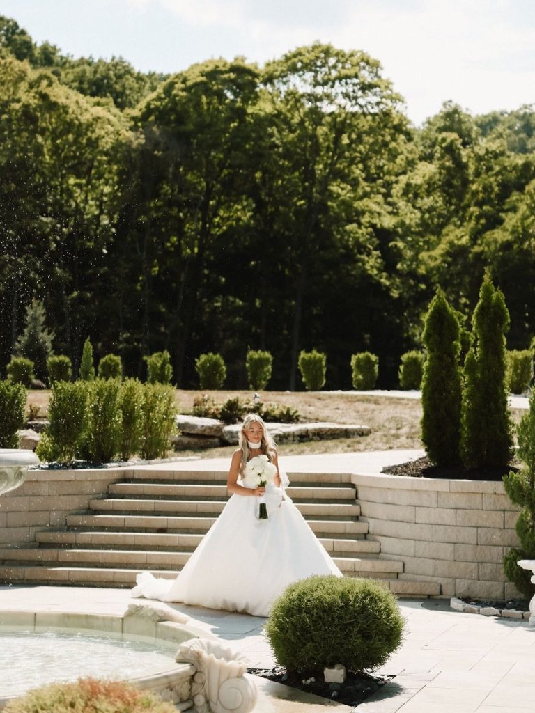 Bride coming down stairs at Knotting Hills captured by Desert Luna Photo.
