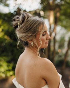 photo of bride showing side profile and her messy updo on wedding day