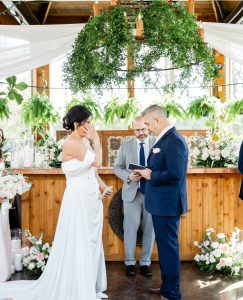 bride and groom exchanging vows at cleveland outdoor venue