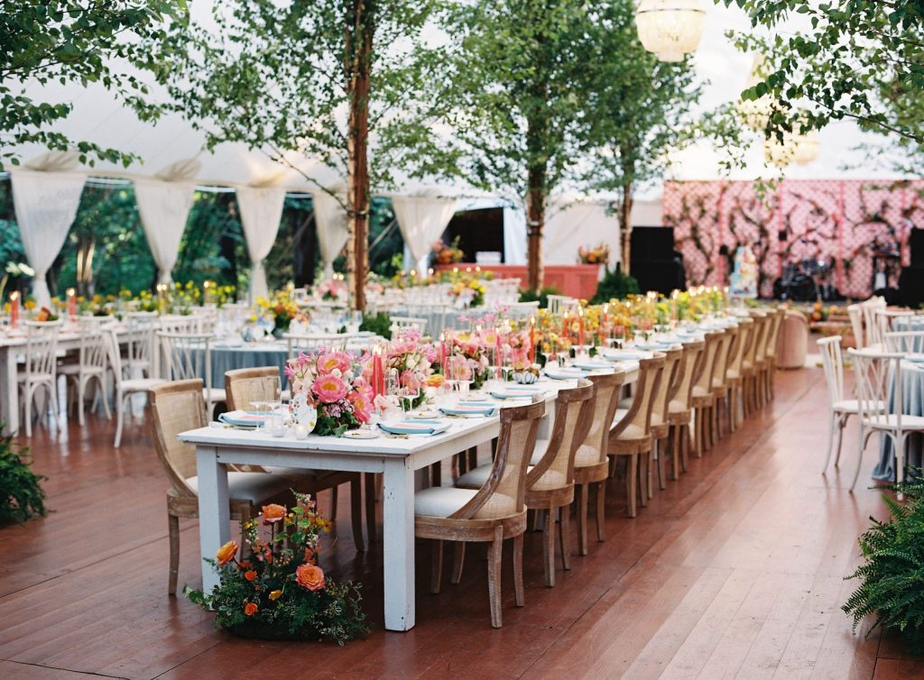 Outdoor wedding ceremony with upscale vintage tables and chairs