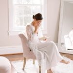 Bride reading letter from groom before wedding