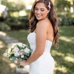 bride posing with old hollywood style hair pinned with ornate hairpain