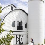 Bride and Groom posing outside of wedding barn in northern virginia