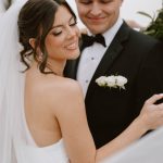 husband and wife taking wedding portraits after wedding ceremony