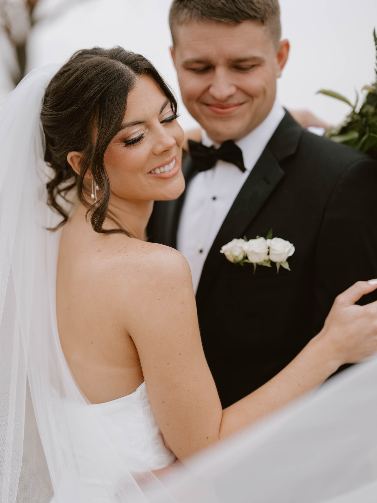 husband and wife taking wedding portraits after wedding ceremony