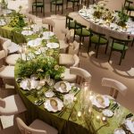 serpent tables at wedding reception with green and white upscale decor rentals