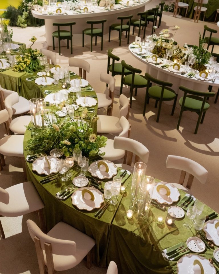 serpent tables at wedding reception with green and white upscale decor rentals