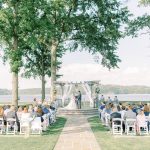 couple getting married at outdoor wedding ceremony golf course