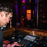 dj spinning dj board at wedding