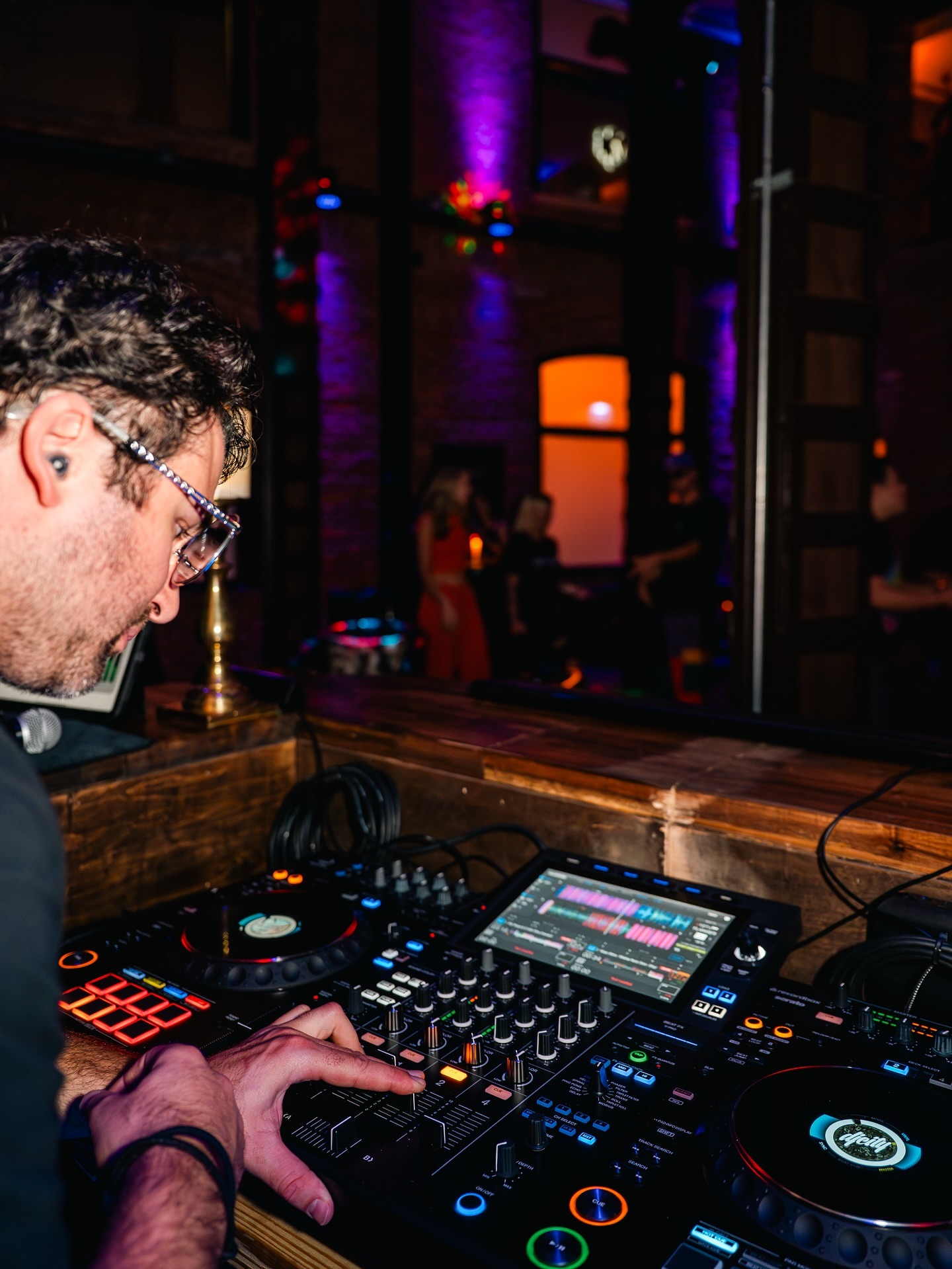 dj spinning dj board at wedding