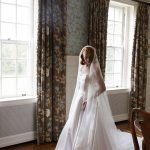 Bridal portrait session indoors with long cathedral length veil