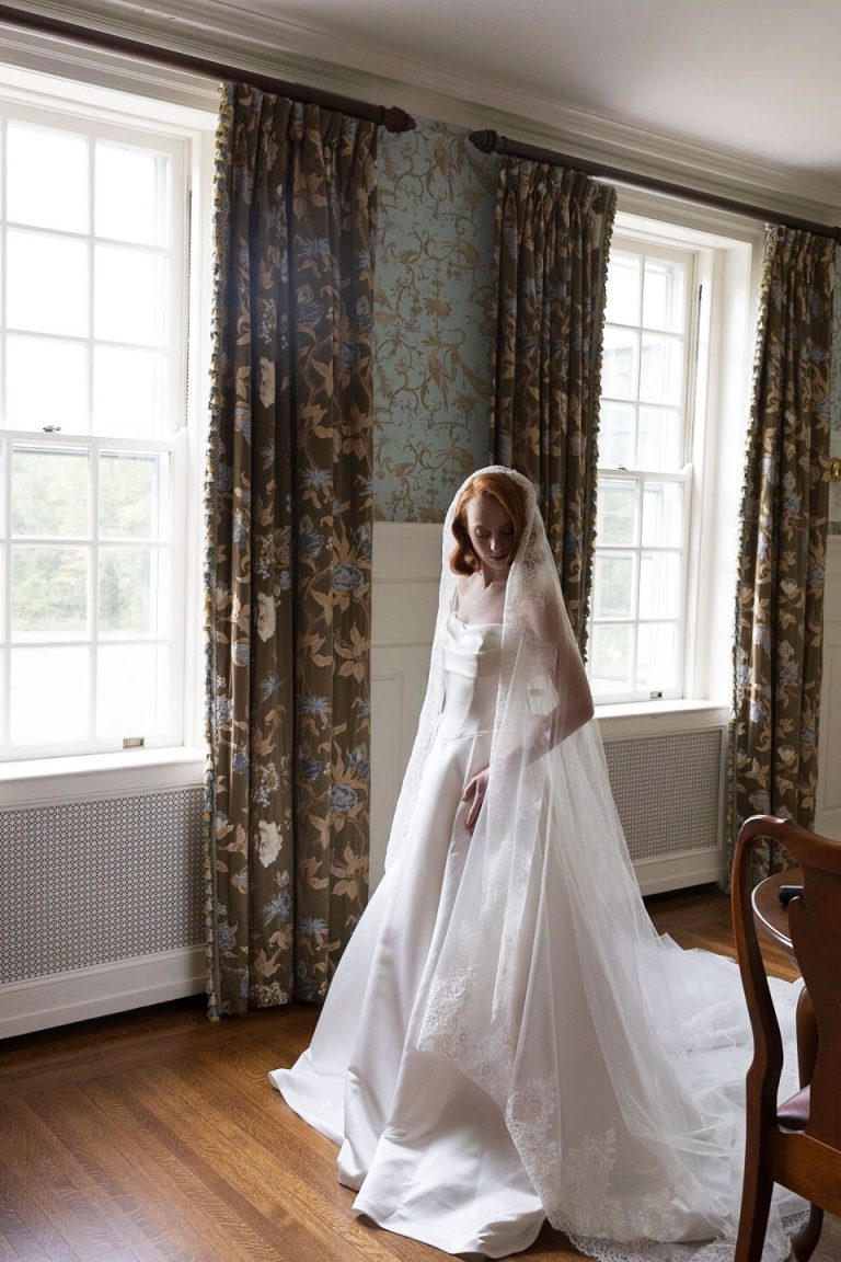 Bridal portrait session indoors with long cathedral length veil