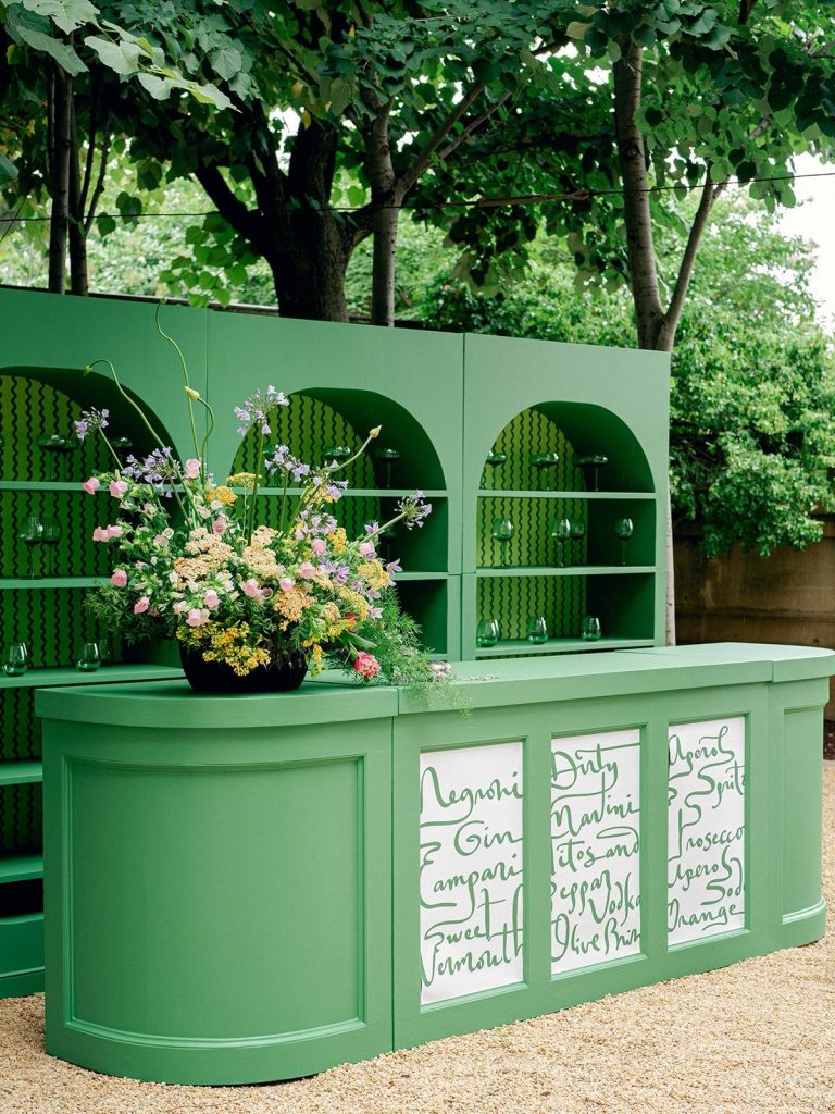 Pastel green bar area at outdoor wedding cocktail hour. personalized wedding decor