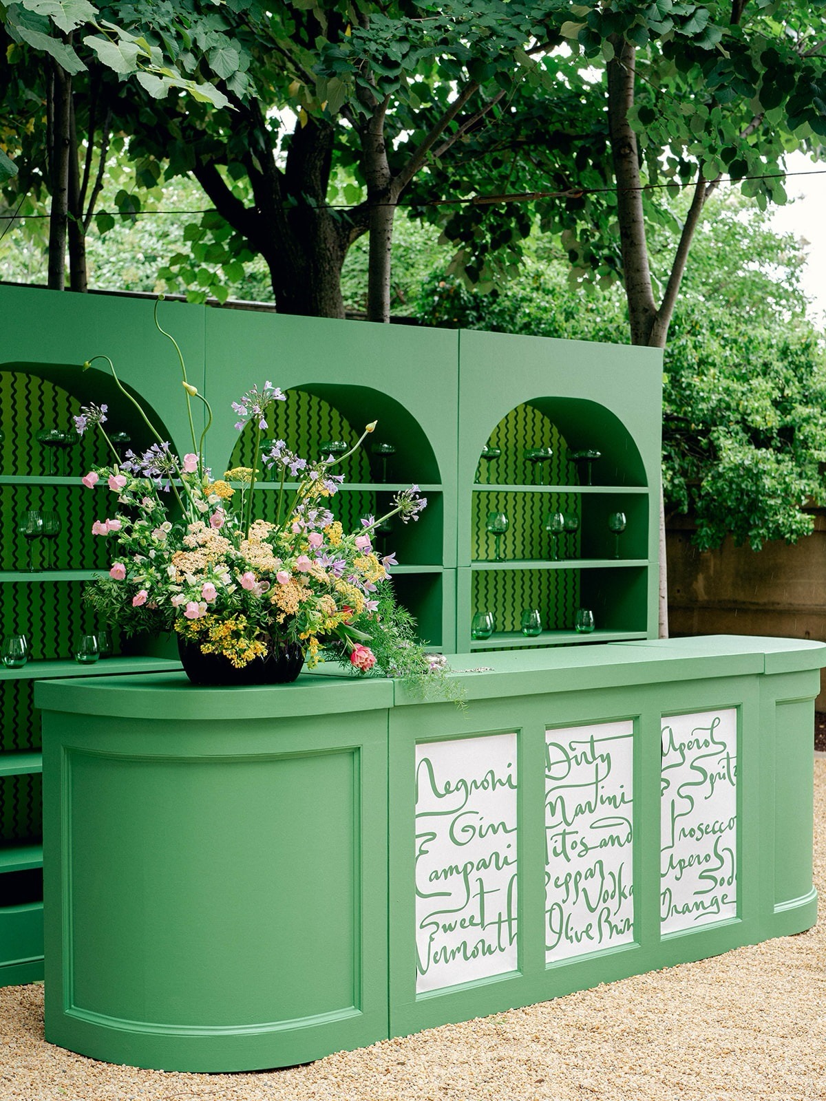 Pastel green bar area at outdoor wedding cocktail hour. personalized wedding decor