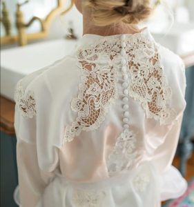 Bride in a custom heirloom bridal robe created by Still Her Dress.