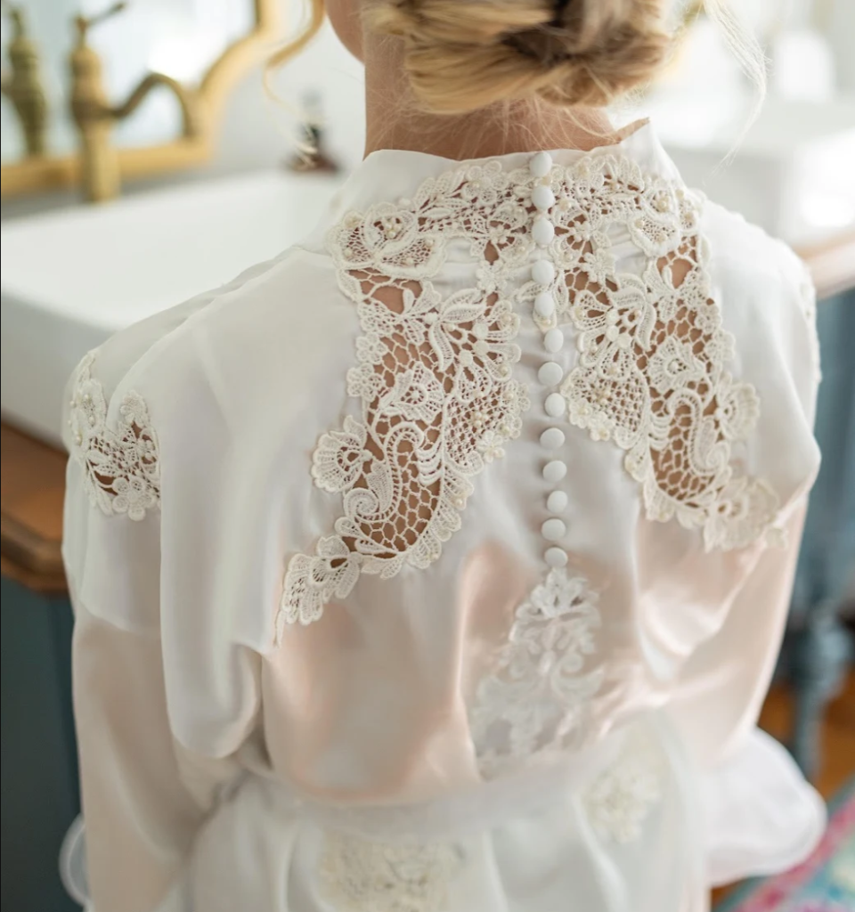 Bride in a custom heirloom bridal robe created by Still Her Dress.