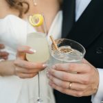 Bride and Groom holding signature cocktails