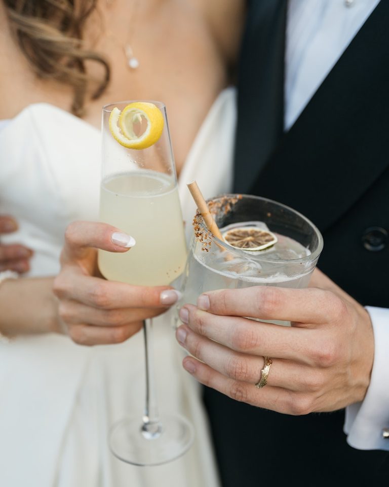 Bride and Groom holding signature cocktails