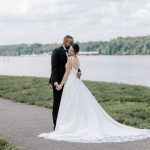 husband and wife taking wedding portraits at gold course in northern virginia