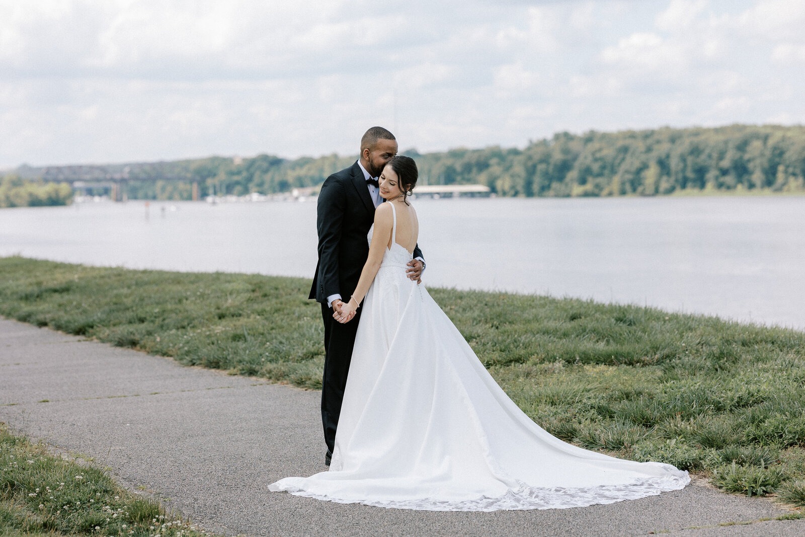 husband and wife taking wedding portraits at gold course in northern virginia