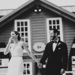 husband and wife smiling during wedding
