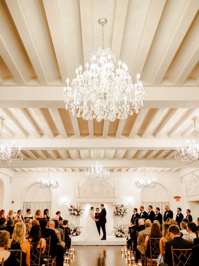 Bride and groom at the aisle with guests surrounding them. Ceremony executed by Hawthorne Creative Co.