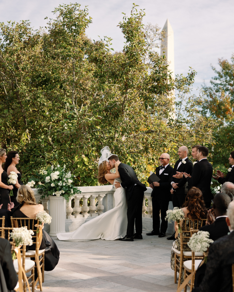 bride and groom first kiss after wedding ceremony at outdoor ceremony in washington dc