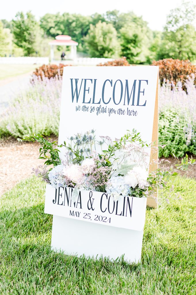 Custom wedding welcome sign for the couple displayed outdoors at King Cole Farm in Delaware.