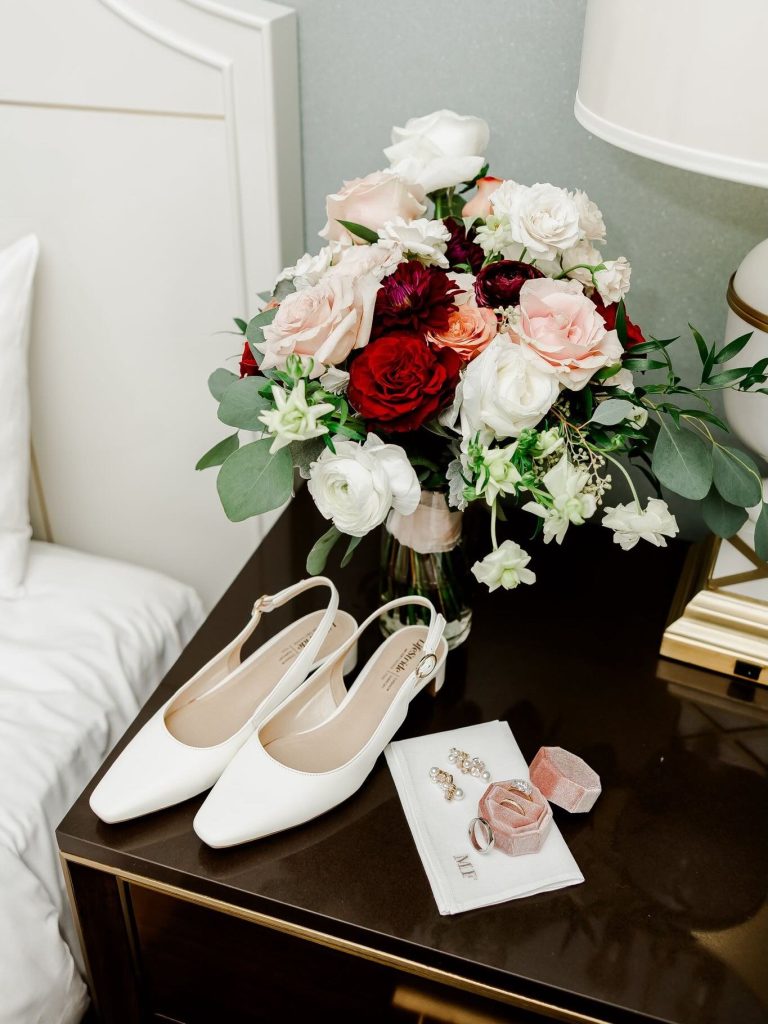 Detail shot with bridal shoes and bouquet captured by Danielle Ambry Photography.