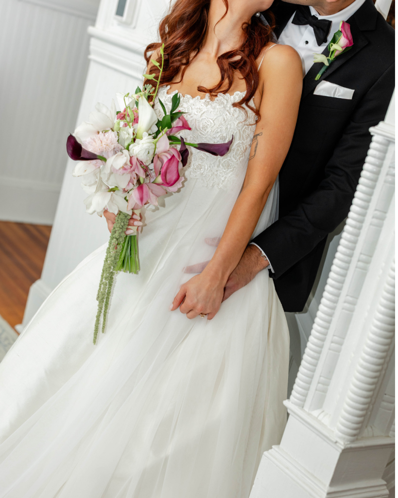 Romantic close up portrait of Morgan and Tyler embracing outdoors during their wedding day at The Grande Victorian.